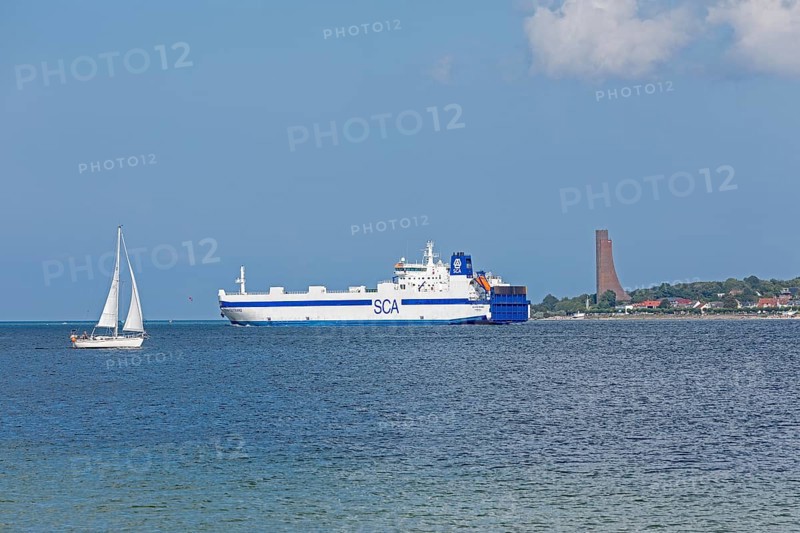 Sailing boat, cargo ship, naval memorial, Laboe, Kiel Fjord, Schleswig-Holstein, Germany