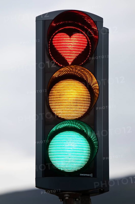 Traffic lights with green light, yellow light and red light in the shape of a heart, symbolic image of traffic light coalition, Akureyri, Iceland