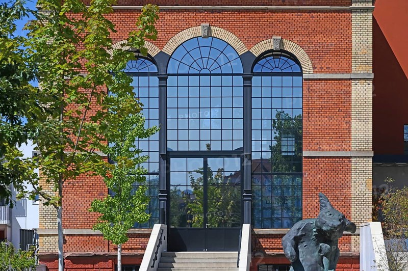Artist's studio of the artist Stefan Strumbel in a former, historic boiler house of a brewery, in front of it a sculpture by the artist, Offenburg, Baden-Württemberg, Germany