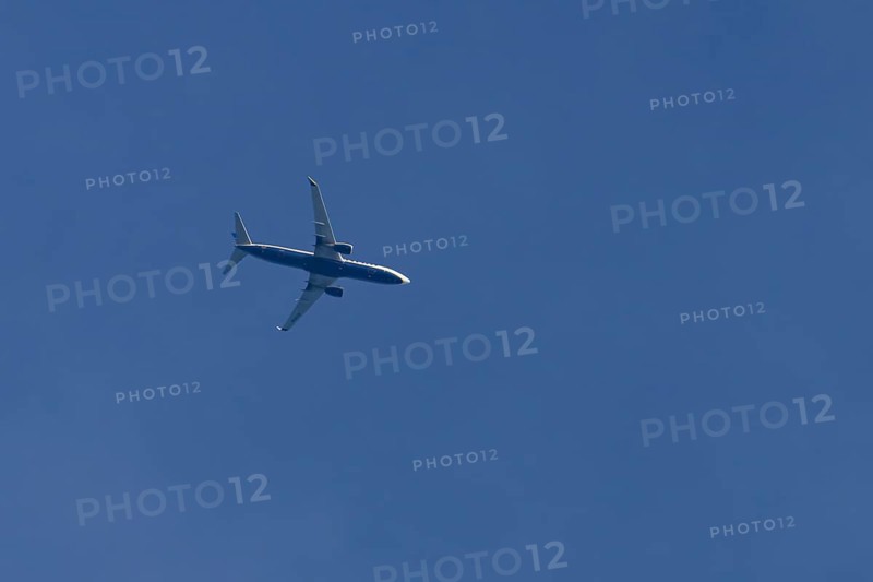 Boeing 737 jet passenger aircraft of Ryanair airlines flying in a blue sky, England, United Kingdom
