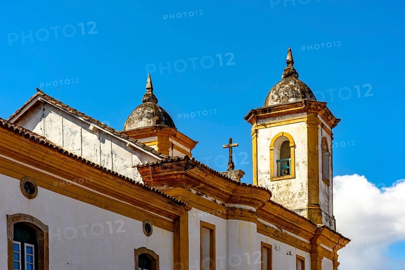 Towers and roof of a historic baroque church in the old city of Ouro Preto