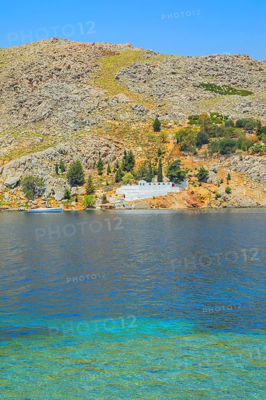 View of the ocean and monastery in the distance from Nimborio Beach, Nimborio, Symi Island, Dodecanese Islands, Greece