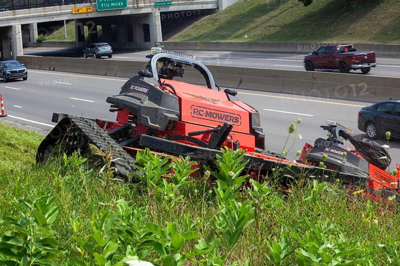 Harper Woods, Michigan, Remote-control mowers are cutting the grass and weeds along Interstate 94 and other freeways running through Detroit. The machines are said to be safer when operating on the steep embankments along most of the city's freeways