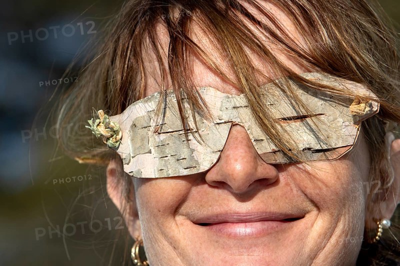 Woman wearing glasses made from birch bark, Gaspesie national park, Province of Quebec, Canada, north America