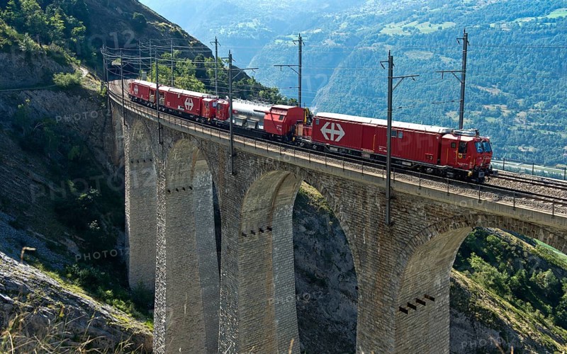 Goods train of the Swiss railway company SBB crosses the Luogelkin Viaduct on the Lötschberg south ramp section near Hohtenn, Valais, Switzerland