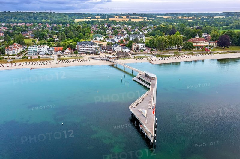 Aerial view over Seebrücke, pier and sandy beach at seaside resort Haffkrug along the Baltic Sea, Scharbeutz, Schleswig-Holstein, Germany
