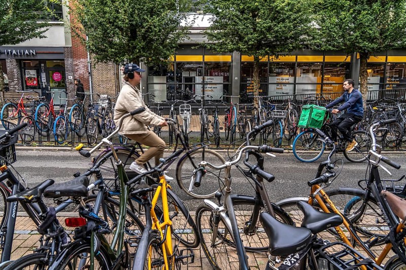 Ride your bike in the city centre of Groningen, old town, designated areas where bikes may be parked, bikes parked outside will be removed, Netherlands