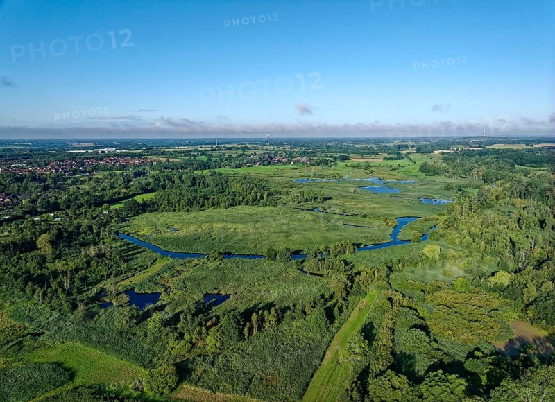 Water surfaces of the Trave and vegetation in the Brenner Moor. Aerial view. The Brenner Moor is a salt marsh, FFH area, in the Trave lowlands near Bad Oldesloe. Schleswig-Holstein, Germany