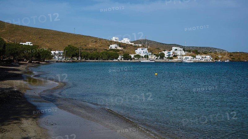 A secluded beach overlooking a coastal settlement and the calm sea, Analipsi, Maltezana, Astypalea, Astipalea, Astipaleia, Dodecanese, Greek Islands, Greece