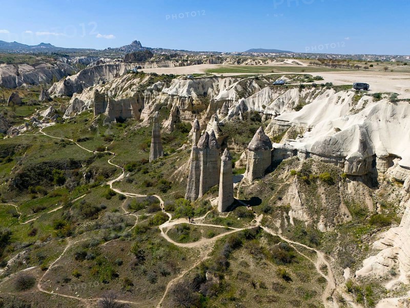 A hilly landscape with iconic rocks and roads in Cappadocia, aerial view, Love Valley, Göreme National Park, Göreme Tarihî Millî Parki, Nevsehir Province, Nevsehir, Cappadocia, Cappadocia, Cappadocia, Cappadocia, Central Anatolia, Turkey