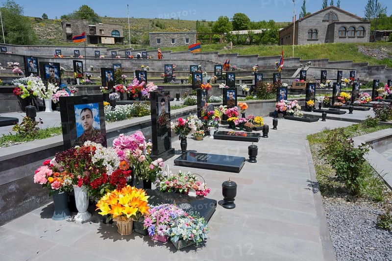 Several decorated graves in a well-tended landscape, extensive floral decorations, graves of 2020, victims of the war between Armenia and Azerbaijan, cemetery, Sisian, Sissian, Sjunik province, historical Sangesur, Armenia