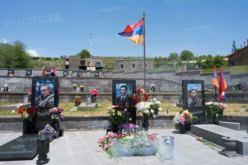 Graves with portraits and flowers in front of the Armenian flag, memorial, graves of 2020, victims of the war between Armenia and Azerbaijan, cemetery, Sisian, Sissian, Sjunik province, historical Sangesur, Armenia