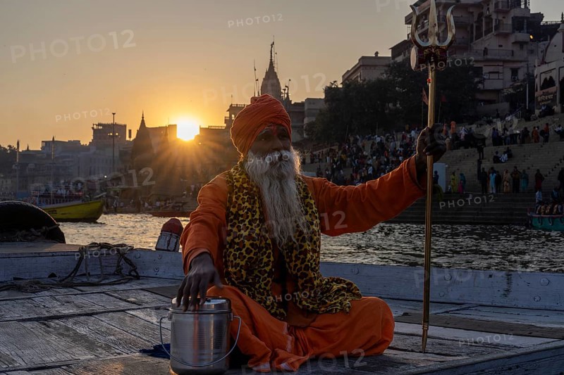 Sadhu with trident on boat, Mughalsarai, Uttar Pradesh, India