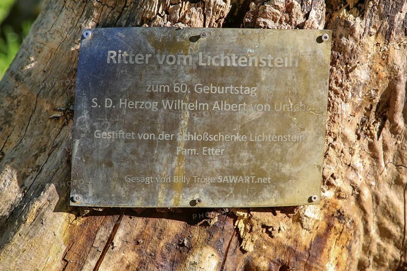 Shield, inscription, Ritter vom Lichtenstein, wooden sculpture sawn by Billy Tröge, artist, for the 60th birthday of H.S.H. Duke Wilhelm Albert von Urach, donated by the Etter family, at Lichtenstein Castle, Honau, municipality of Lichtenstein, Baden-Württemberg, Germany
