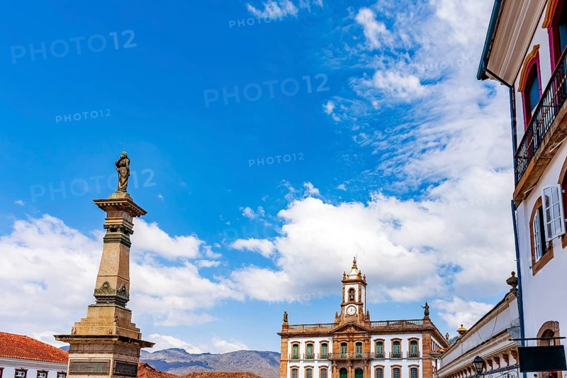 Historic facades and a statue of Tiradentes in the central square of the historic city of Ouro Preto in Minas Gerais, Ouro Preto, Minas Gerais, Brazil