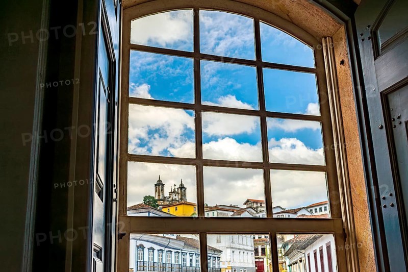 City of Ouro Preto seen through the window of an old colonial-style house, Ouro Preto, Minas Gerais, Brazil