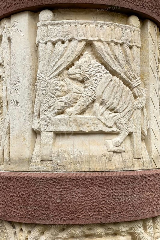 Stone relief half relief motif on fairy tale fountain from fairy tale Little Red Riding Hood and the evil wolf bites man, Steinau an der Straße, Hesse, Germany