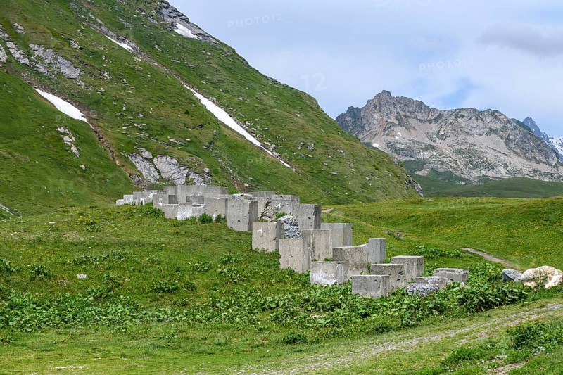 Historical border fortification military border fortification from World War II in the form of concrete blocks Blocks made of concrete on the border 2188 metre high border pass in the Alps between France and Italy Little Saint Bernard Pass, Col du Petit Saint-Bernard, Colle del Piccolo San Bernardo, Département Savoie, France, Region Valle d'Aosta, Italy