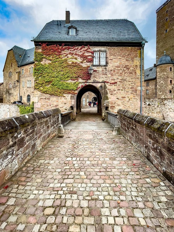 Front access with historic bridge over moat Hirschgraben to gatehouse of Steinau Castle, Steinau an der Straße, Hesse, Germany