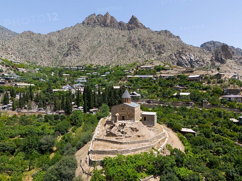 Historic mountain church surrounded by lush vegetation and impressive mountains, aerial view, St John's Church, Surb Howhannes, Meghruvank Monastery, Basilica, Meghri, Syunik Province, not far from the border with Iran, Armenia, Asia