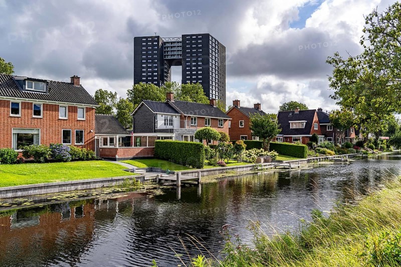 Tasmantoren residential tower block in the Oosterhogebrug district in the city of Groningen, 75 metres high with 218 flats on 23 floors, residential buildings on Rijksweg on the Damsterdiep canal, Netherlands