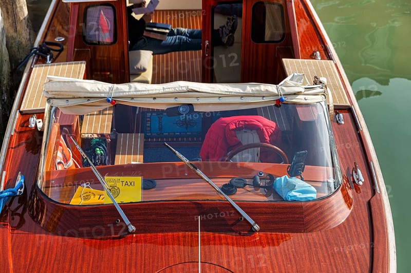Water taxi, taxi boat, view from above, captain taking a break, Murano, group of islands in the lagoon of Venice, Italy
