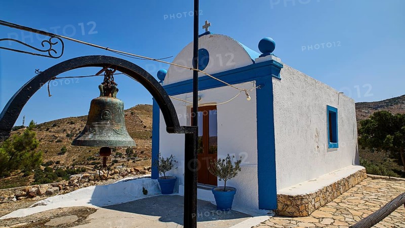 Small white-blue chapel in the countryside with bell in the foreground and blue sky in the background, Panagia tou Paleokastro, Church of the Old Fortress, Chapel, Panagia Kasteli, Lepides, Leros, Dodecanese, Greek Islands, Greece