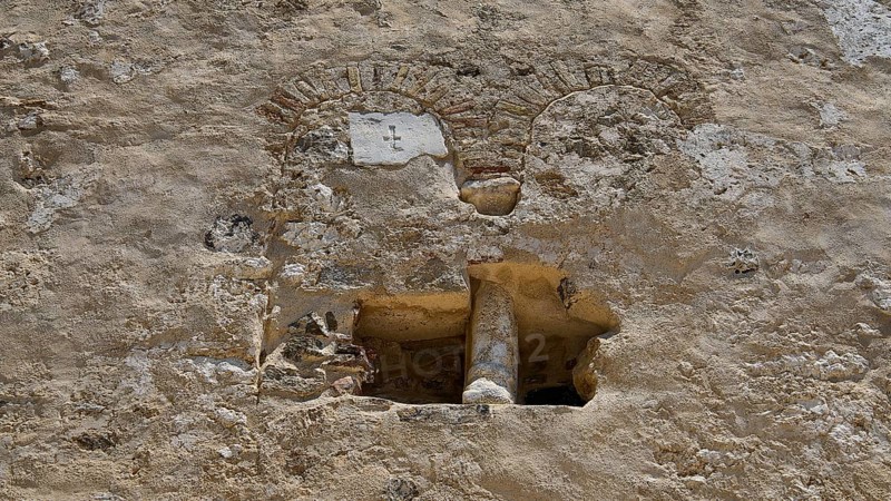 Close-up of a historic stone wall with rustic details, built-in antique column, basilica, church, Agios Theologos, Leros, Dodecanese, Greek Islands, Greece
