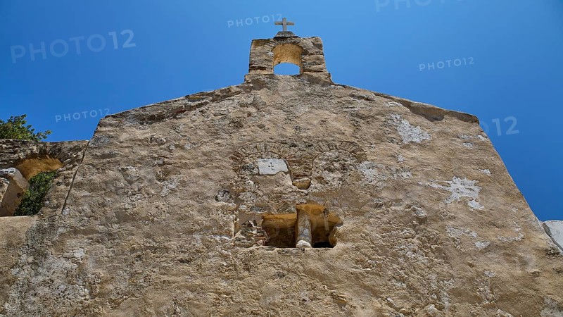 Detail of a stone church façade with architectural elements and steeple, Basilica, Church, Agios Theologos, Leros, Dodecanese, Greek Islands, Greece
