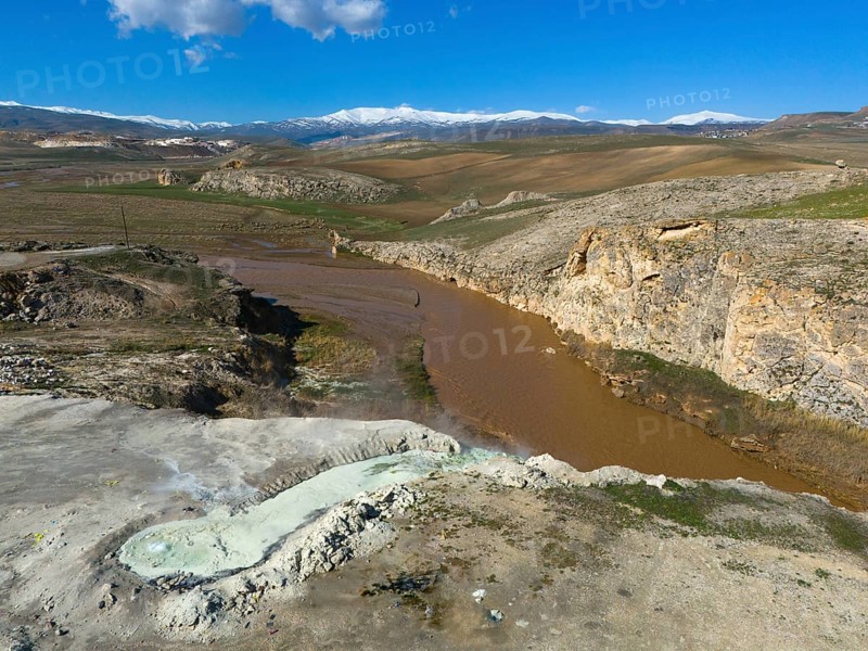 Vast landscape with brown river and rocky gorge under blue sky and white clouds, aerial view, thermal springs, Diyadin, Murat River, Agri Province, Agri, Eastern Anatolia, Turkey