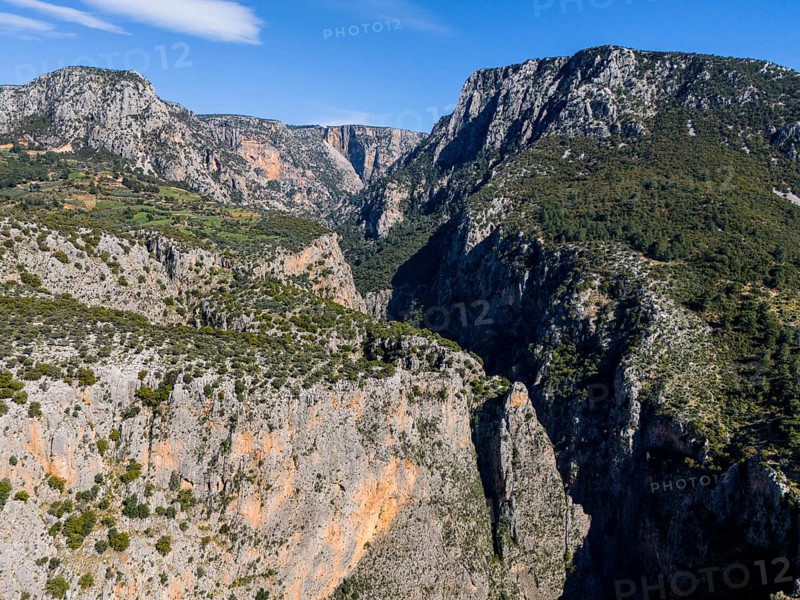 Deep gorge with imposing rocks and green vegetation under a clear blue sky, aerial view, Saklikent Gorge, Saklikent, Saklikent National Park, Antalya Province, Turkey