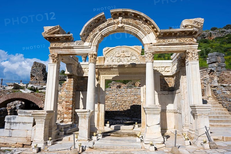 Ancient ruins with an ornate arch and columns against a blue sky, Hadrian's Temple, Efes, Ephesus, Ephesus, UNESCO World Heritage Site, Izmir Province, Ionia, Turkey