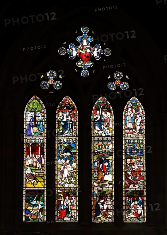 Stained glass window with religious depictions and bright colours, St. Mary Abbot Church, Kensington, London, England, Great Britain
