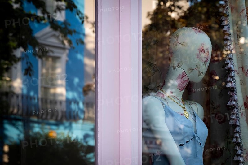 Mannequin in floral pattern, reflection in shop window, Portobello Road, Notting Hill, London, England, Great Britain