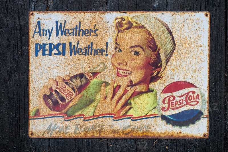 Retro Pepsi advertising sign with smiling woman and nostalgic design, Ringkøbing, Ringkøbing Fjord, Denmark