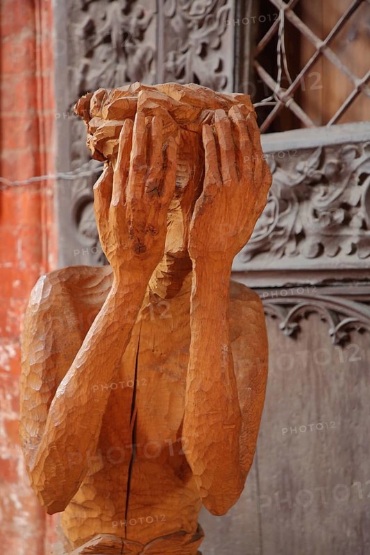 Wooden figure with hands in front of the face, interior view, wooden sculpture, modern art, wood carving, handicraft, life-size, arms, head, nothing, see, no, privacy, protect, protected, hide, hidden, fear, emotion, St. Nikolai, Wismar, Mecklenburg-Vorpommern, Germany