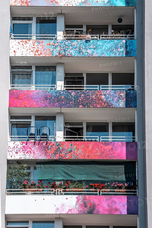 High-rise residential building, in Essen-Steele, with colourfully designed façade, balcony balustrades, after renovation, North Rhine-Westphalia, Germany