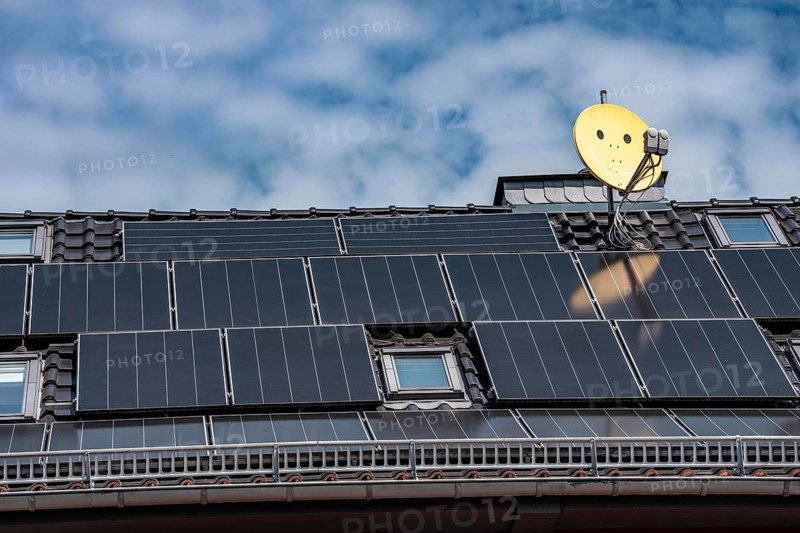 Residential building with photovoltaic modules on the roof, North Rhine-Westphalia, Germany