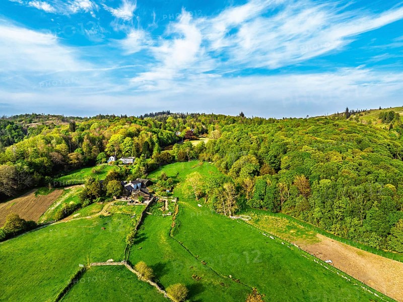 Farms over Coniston Water from drone, Lake District National Park, Cumbria, UK