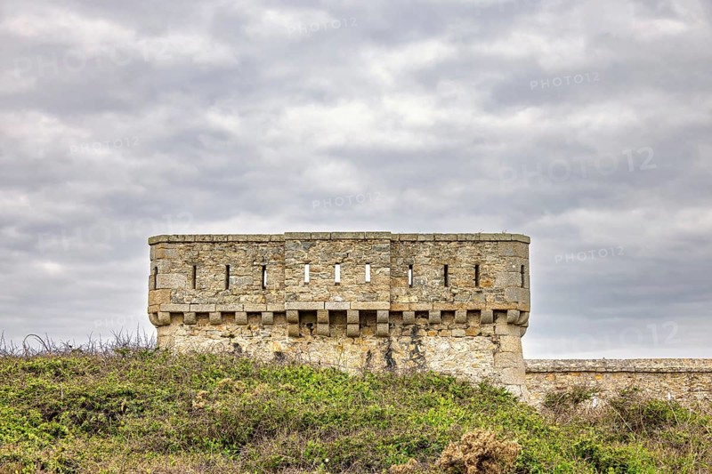 Old fort tower at Pointe du Toulinguet with a cloudy sky, Camaret-sur-Mer, Crozon peninsula, Bretagne, France