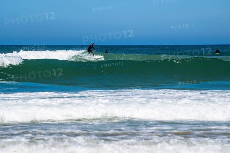 Surfer riding a wave on Contis beach, Saint Julien en Born, Saint-Julien-en-Born, Landes, France