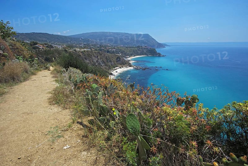 Nature trail along the coast with cacti and views of the blue sea, Ricadi, Capo Vaticano