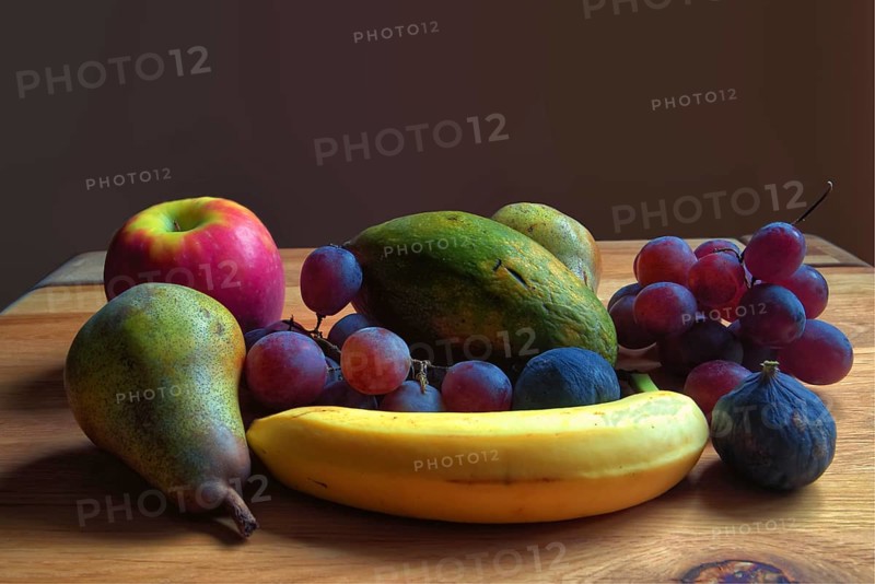 Fresh fruit arrangement of pears, grapes and bananas on a wooden table, Willich, North Rhine-Westphalia