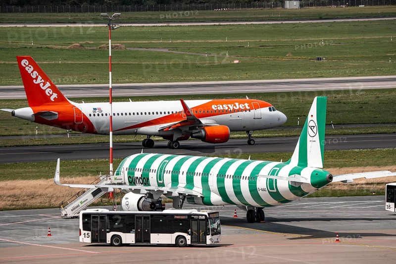 Düsseldorf Airport, Condor Airbus A321-200, aircraft on the apron, EasyJet Airbus A320-200 taxiing for take-off, North Rhine-Westphalia, Germany