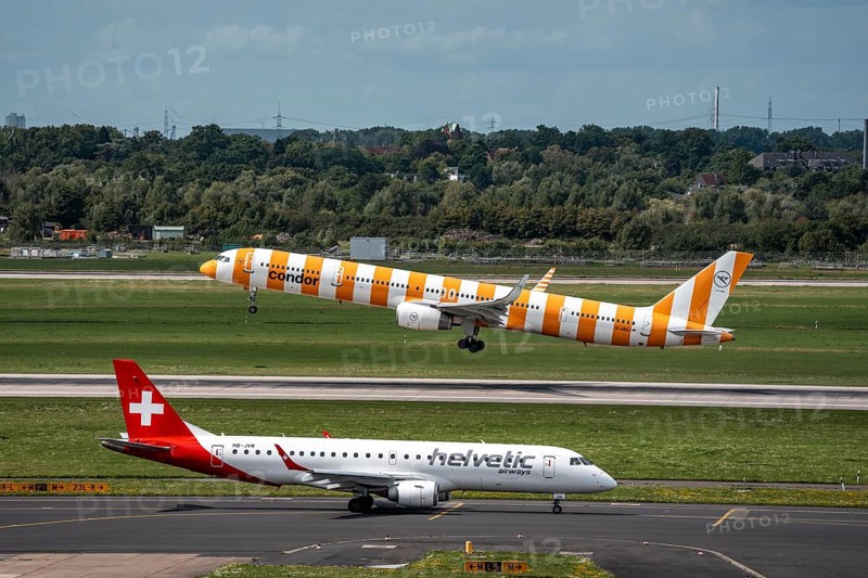 Düsseldorf Airport, Condor Boeing 757-330 on take-off, Helvetic Airways Embraer E190LR on the way to take-off, North Rhine-Westphalia, Germany