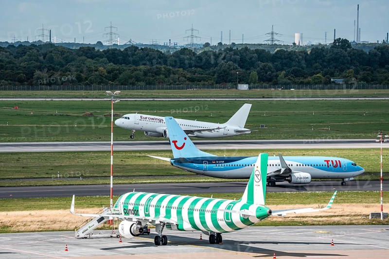 Düsseldorf Airport, Condor Airbus A321-200, aircraft on the apron, TUIFly Boeing 737 on the way to take-off, Eurowings Airbus on take-off, North Rhine-Westphalia, Germany