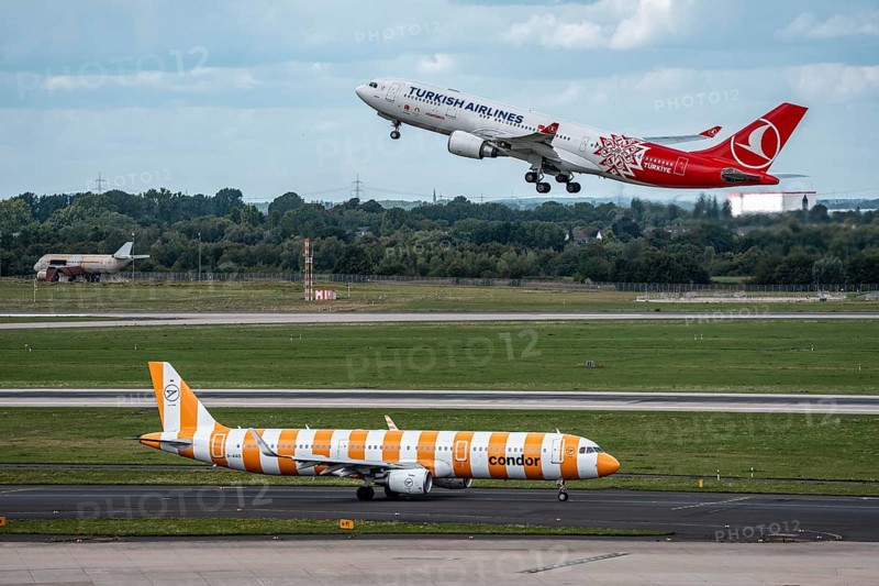 Düsseldorf Airport, Condor Airbus A321-211 on the taxiway for take-off, Turkish Airlines Airbus A330-200 on take-off, North Rhine-Westphalia, Germany