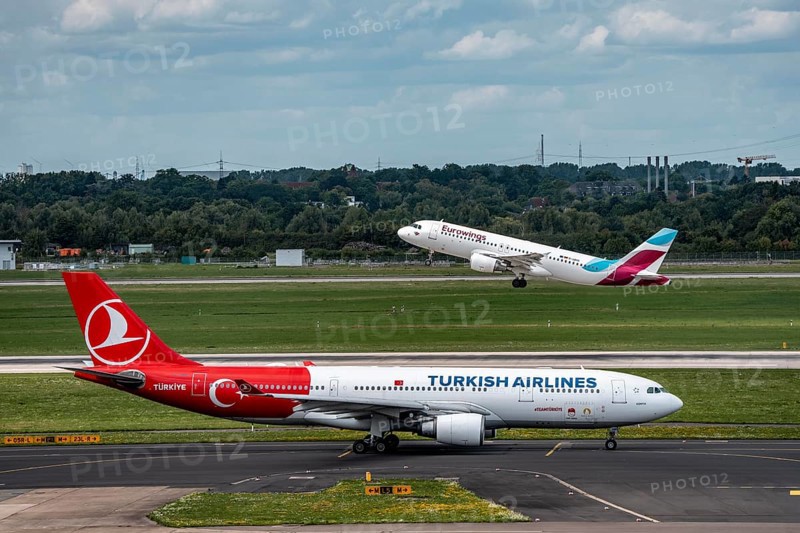 Düsseldorf Airport, Eurowings Airbus on take-off, Turkish Airlines Airbus A330-200 on the taxiway for take-off, North Rhine-Westphalia, Germany