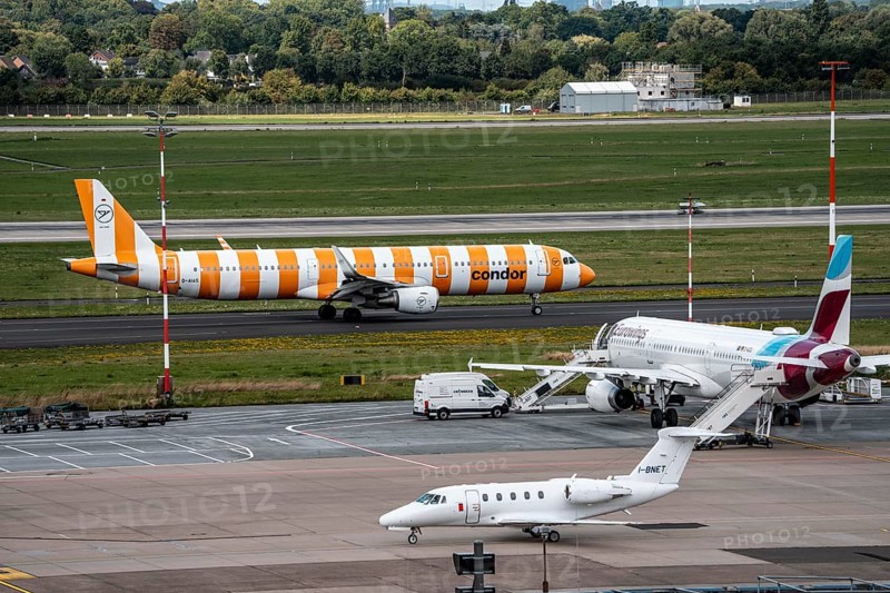 Düsseldorf Airport, Condor Airbus aircraft on the apron, Eurowings Airbus, private aircraft Cessna Citation VII, Airline Aliserio on the way to take-off, North Rhine-Westphalia, Germany