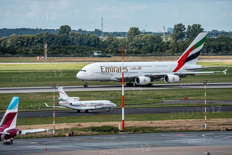 Düsseldorf Airport, Emirates Airbus A380-800, on take-off, Dassault Falcon 7X, of the American company S. C. Johnson & Son on the way to take-off, North Rhine-Westphalia, Germany